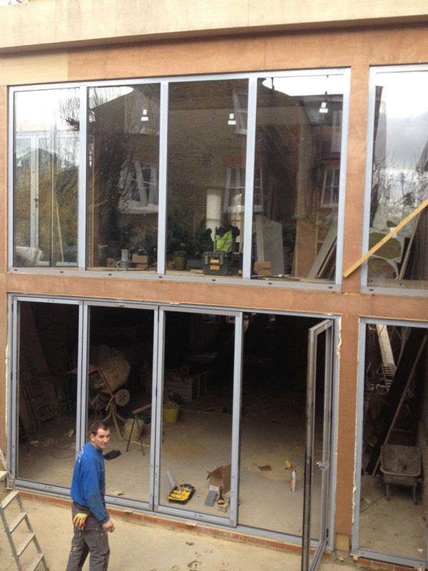 Aluminium bi-fold doors with two-storey glazing in East Dulwich